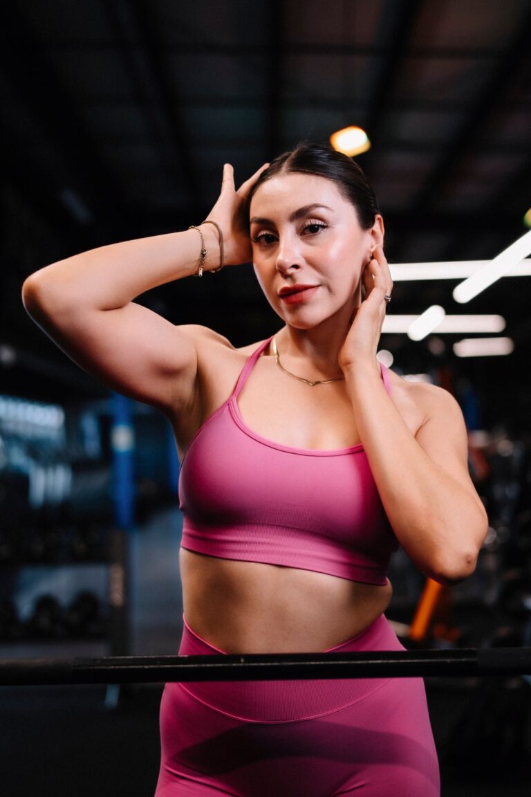 Placeholder: woman in pink athletic wear in a gym